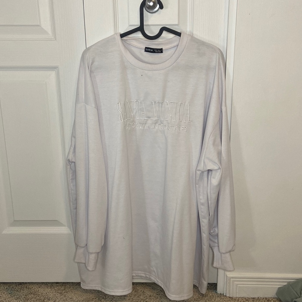 White sweater.